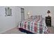 Bedroom featuring a bed with a plaid comforter set, a closet, and soft carpeting at 30066 N Holly Dr, San Tan Valley, AZ 85144