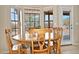 Bright breakfast nook with a wood table set and a large window view of the desert landscape at 30066 N Holly Dr, San Tan Valley, AZ 85144