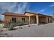 Attractive desert home with a covered porch, mature landscaping, and inviting curb appeal at 30066 N Holly Dr, San Tan Valley, AZ 85144