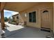Charming covered porch featuring stylish seating and a welcoming entrance at 30066 N Holly Dr, San Tan Valley, AZ 85144