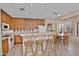 Cozy kitchen featuring a breakfast bar and adjacent dining area at 30066 N Holly Dr, San Tan Valley, AZ 85144