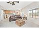 Open-concept living space with a kitchen, dining area, and mountain views from the large window at 30066 N Holly Dr, San Tan Valley, AZ 85144