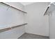 Spacious walk-in closet featuring wood shelving at 30066 N Holly Dr, San Tan Valley, AZ 85144