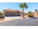 Attractive home with mature landscaping, a gated entry, and a well-maintained driveway at 3245 N 147Th Ln, Goodyear, AZ 85395