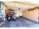 Spacious garage featuring ample storage cabinets, a golf cart, and a well-organized layout at 3245 N 147Th Ln, Goodyear, AZ 85395