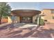 Private backyard with a covered patio and low-maintenance landscaping perfect for relaxation and outdoor living at 325 W Seaside Dr, Casa Grande, AZ 85122
