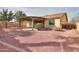 Spacious backyard featuring desert landscaping and covered patio, ideal for outdoor entertaining at 325 W Seaside Dr, Casa Grande, AZ 85122