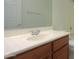 Bathroom featuring wood cabinets, neutral countertop, and chrome hardware at 325 W Seaside Dr, Casa Grande, AZ 85122