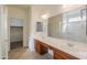 Bathroom featuring double sinks, spacious countertops, and access to a walk-in closet at 325 W Seaside Dr, Casa Grande, AZ 85122