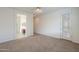 Bedroom featuring access to bathroom and view of the secure front door at 325 W Seaside Dr, Casa Grande, AZ 85122