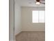 Bedroom with carpet, a large window, and a ceiling fan offering comfortable living at 325 W Seaside Dr, Casa Grande, AZ 85122