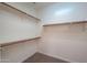 Walk-in closet featuring multiple wood shelves and ample storage space at 325 W Seaside Dr, Casa Grande, AZ 85122