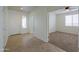 Hallway leading to another bedroom featuring carpet floors, a ceiling fan, and great lighting at 325 W Seaside Dr, Casa Grande, AZ 85122