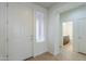 Bright entryway showcasing tile floors, a sidelight window, and a half bathroom at 325 W Seaside Dr, Casa Grande, AZ 85122