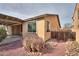 A well-maintained home exterior featuring low-maintenance landscaping and a covered patio area at 325 W Seaside Dr, Casa Grande, AZ 85122