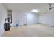 Spacious garage featuring painted floors, utility connections, and multiple access doors at 325 W Seaside Dr, Casa Grande, AZ 85122