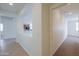 Hallway with tile flooring and view into kitchen at 325 W Seaside Dr, Casa Grande, AZ 85122