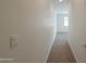 Hallway with carpet flooring, white walls, and white trim at 325 W Seaside Dr, Casa Grande, AZ 85122