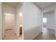 Hallway featuring tile flooring that provides access to a bathroom and bedroom at 325 W Seaside Dr, Casa Grande, AZ 85122