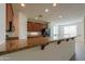 Granite breakfast bar overlooking a kitchen with sleek, black appliances and ample cabinet space at 325 W Seaside Dr, Casa Grande, AZ 85122