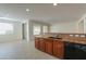 Kitchen bar featuring granite countertops, stainless steel sink, and view to outside at 325 W Seaside Dr, Casa Grande, AZ 85122
