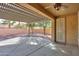Covered patio with ceiling fan provides ample space for outdoor living and entertaining overlooking the landscaped backyard at 325 W Seaside Dr, Casa Grande, AZ 85122