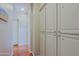 Hallway with wood floors and lots of extra storage and shelving at 32960 N 70Th St, Scottsdale, AZ 85266