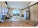 Well-equipped kitchen boasting granite countertops, modern appliances, and ample storage space at 32960 N 70Th St, Scottsdale, AZ 85266