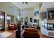 Bright living room features hardwood floors, high ceilings, and a cozy fireplace at 32960 N 70Th St, Scottsdale, AZ 85266