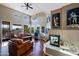 Spacious living room boasts high ceilings, expansive windows, and a cozy fireplace at 32960 N 70Th St, Scottsdale, AZ 85266
