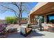 Relaxing covered patio featuring comfortable furniture and serene desert views at 32960 N 70Th St, Scottsdale, AZ 85266