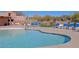 Outdoor pool area featuring a tanning deck, lounge chairs, and desert landscaping at 32960 N 70Th St, Scottsdale, AZ 85266