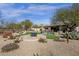 Desert backyard with a firepit and beautiful vegetation at 33250 N 71St St, Scottsdale, AZ 85266