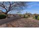 Spacious backyard with a built-in grill and a fire pit perfect for entertaining at 33250 N 71St St, Scottsdale, AZ 85266