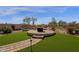 Manicured backyard featuring an outdoor firepit at 33250 N 71St St, Scottsdale, AZ 85266