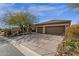 Charming one-story home with a two-car garage and desert landscaping for low maintenance at 33250 N 71St St, Scottsdale, AZ 85266