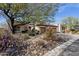 Charming single-story home featuring a desert landscaped front yard and attached two car garage at 33250 N 71St St, Scottsdale, AZ 85266
