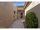 Inviting front entrance featuring a decorative security door and neutral tile walkway at 33250 N 71St St, Scottsdale, AZ 85266