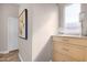Inviting hallway featuring neutral tones, wood floors, and natural light at 33250 N 71St St, Scottsdale, AZ 85266