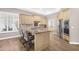 Kitchen with a large island, stainless steel appliances, custom cabinets, and tile backsplash at 33250 N 71St St, Scottsdale, AZ 85266