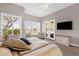 Cozy bedroom with plantation shutters, TV, and plush carpet at 33250 N 71St St, Scottsdale, AZ 85266