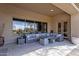 Expansive covered patio featuring comfortable seating and scenic views at 33250 N 71St St, Scottsdale, AZ 85266