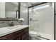 Bathroom featuring a glass-enclosed shower, modern vanity, and neutral color scheme at 3369 E Penedes Dr, Gilbert, AZ 85298