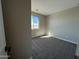 Comfortable bedroom with a window, neutral carpet, and natural light at 3463 S 175Th Ln, Goodyear, AZ 85338