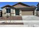 Charming single-story home with a two-car garage and desert landscaping at 3463 S 175Th Ln, Goodyear, AZ 85338