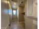 Bright laundry room with tile floors, a window, a shelf, and updated appliances at 3463 S 175Th Ln, Goodyear, AZ 85338