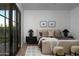 Serene bedroom with cozy furnishings and a relaxing ambiance with access to the outdoors at 3634 N 47Th St, Phoenix, AZ 85018