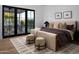 Bright bedroom offers an inviting space with a well-coordinated palette and patio access at 3634 N 47Th St, Phoenix, AZ 85018