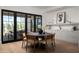 Stylish dining area featuring a round table, contemporary decor, and large windows to a private yard at 3634 N 47Th St, Phoenix, AZ 85018
