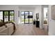 Bright foyer featuring hardwood floors, black framed windows and modern decor at 3634 N 47Th St, Phoenix, AZ 85018